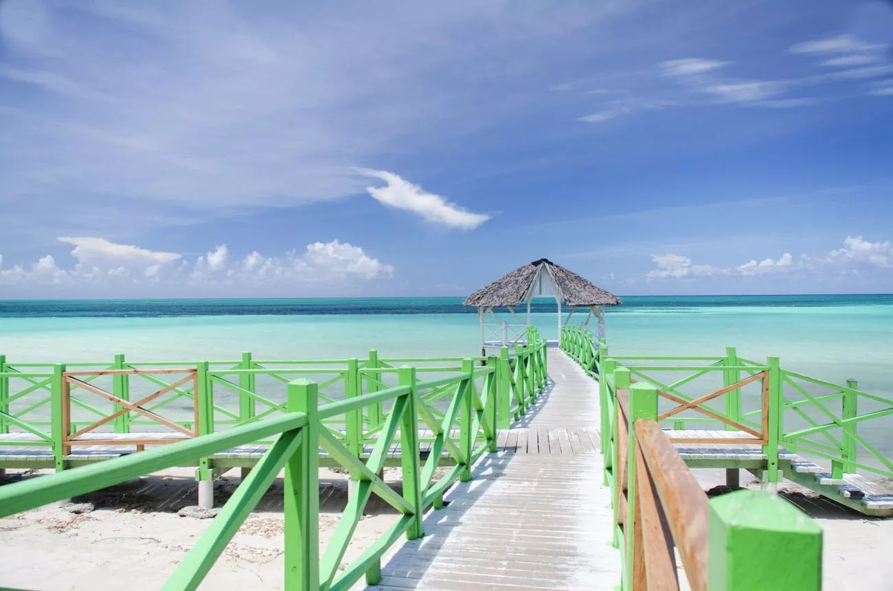 bridge over the green water of cayo coco